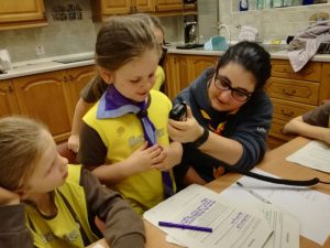 Brownies learning to use a radio communicator