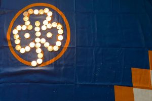 WAGGGS flag with tealights forming trefoil