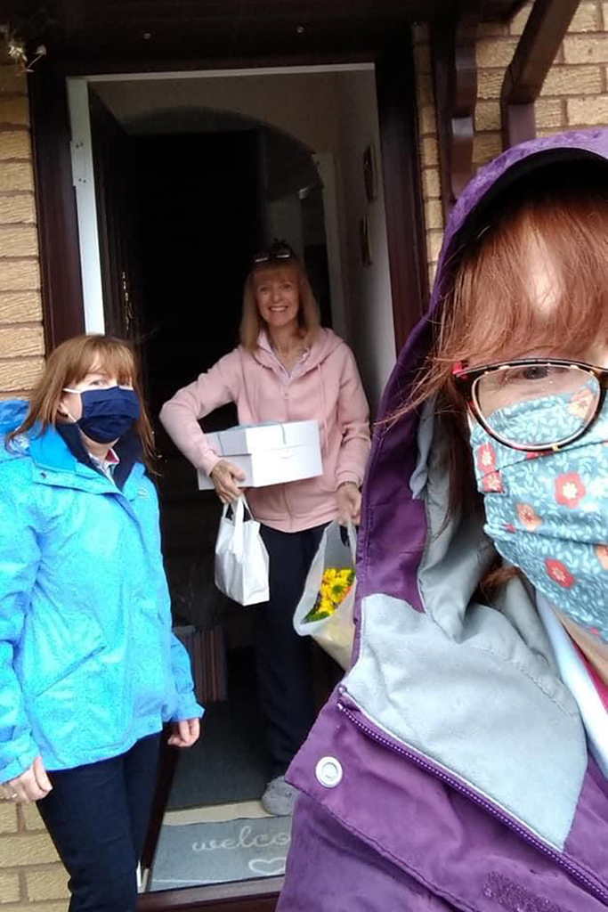 Selfie two women delivering gifts to doorstep